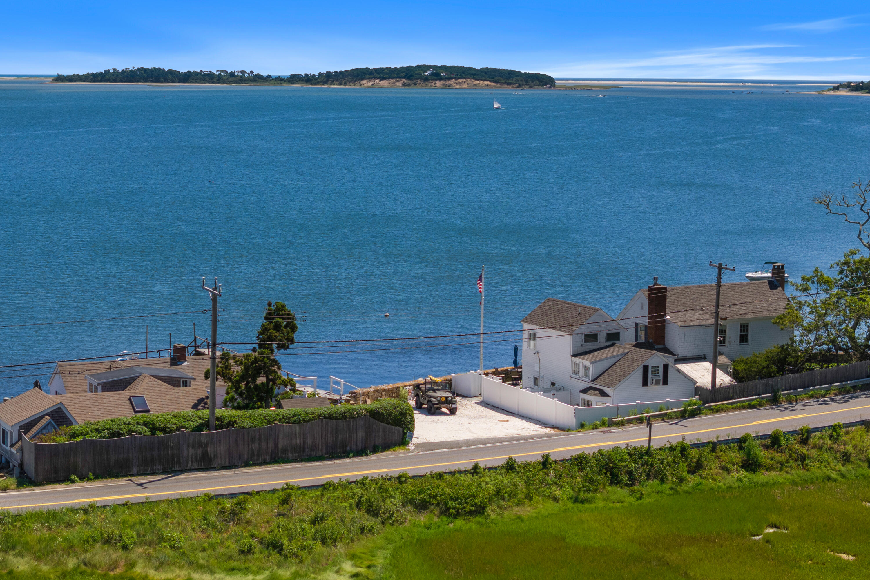 645 South Orleans Road Orleans, MA 02653 - Photo 5 of 57 a view of a table and chairs in patio