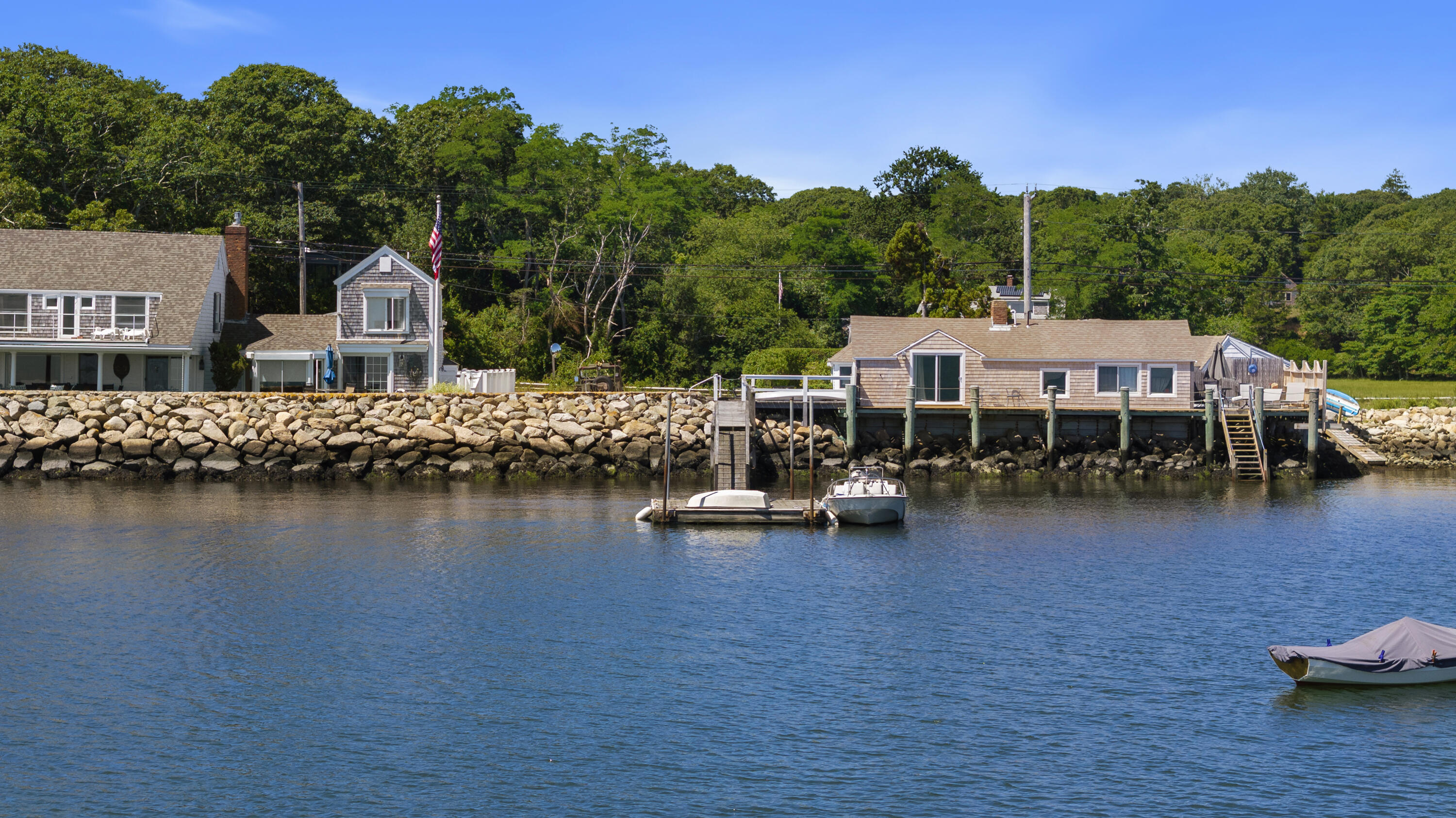 645 South Orleans Road Orleans, MA 02653 - Photo 7 of 57 a view of a lake with houses