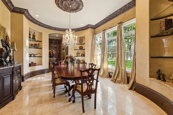 a dining room with furniture and window