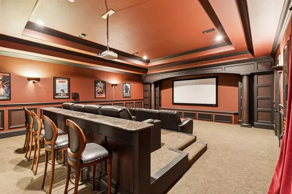 a lobby with furniture and a chandelier