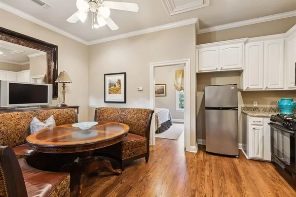 a kitchen with a dining table and chairs