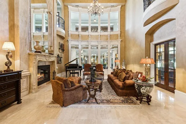 a room with lots of chairs and mirrors