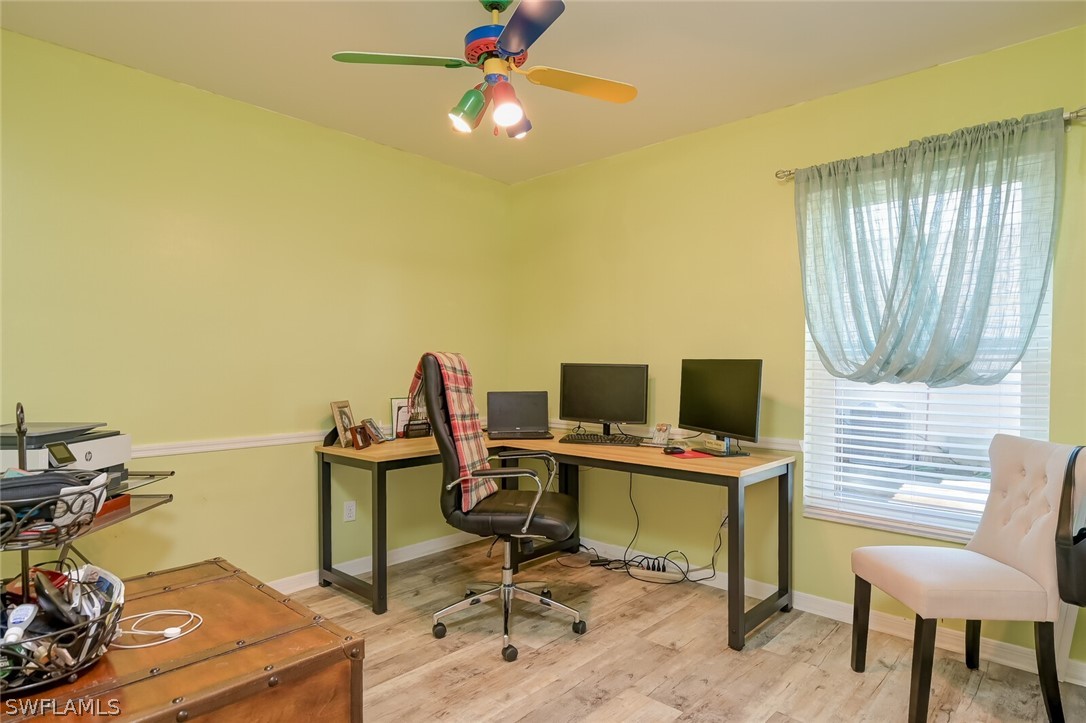 18253 Maple Road Fort Myers, FL 33967 - Photo 19 of 29 a view of a workspace with furniture and a window