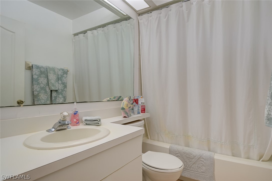 18253 Maple Road Fort Myers, FL 33967 - Photo 21 of 29 a bathroom with a sink toilet and a mirror