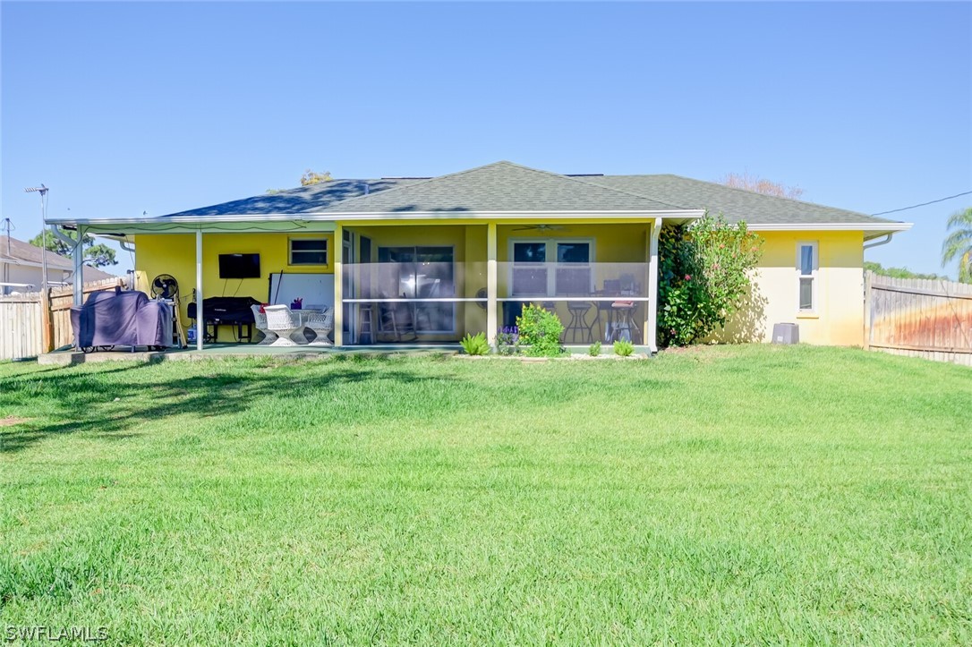 18253 Maple Road Fort Myers, FL 33967 - Photo 25 of 29 a view of a house with a big yard and large trees
