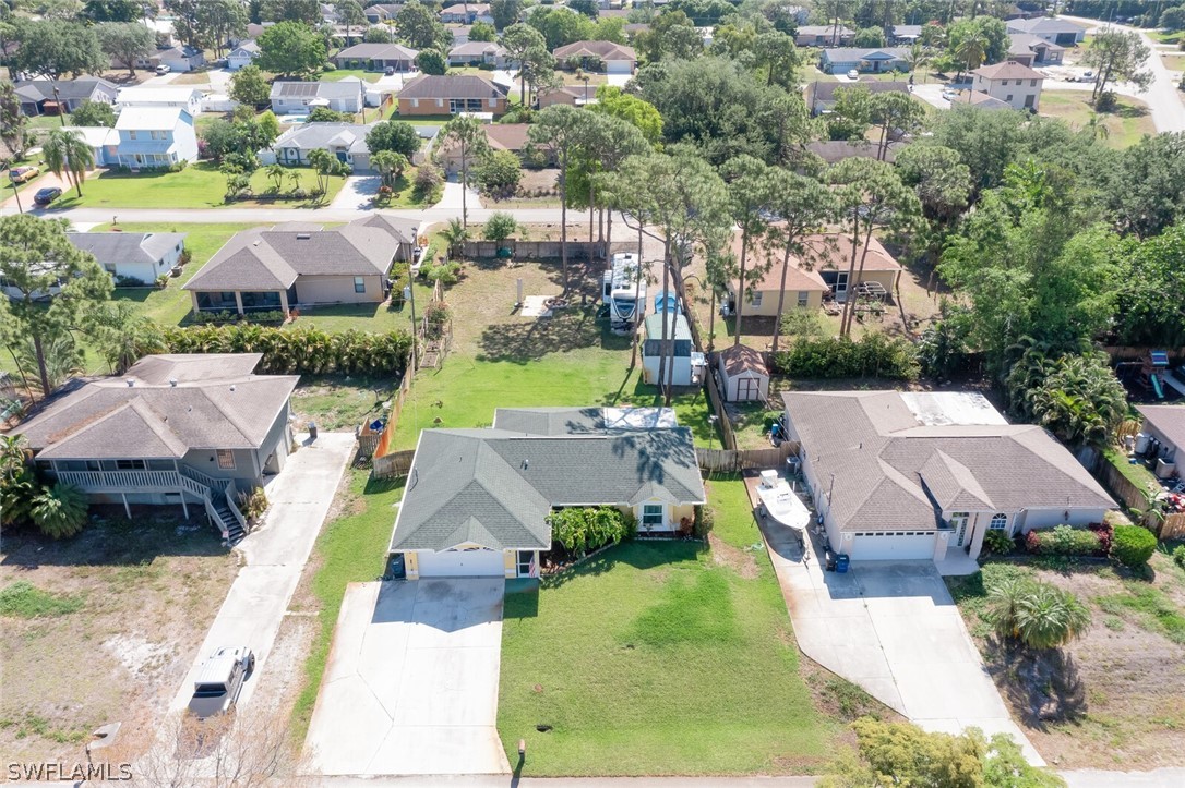 18253 Maple Road Fort Myers, FL 33967 - Photo 3 of 29 an aerial view of multiple houses with yard