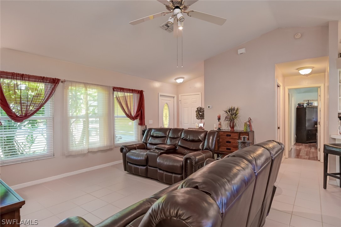 18253 Maple Road Fort Myers, FL 33967 - Photo 7 of 29 a living room with furniture and a large window