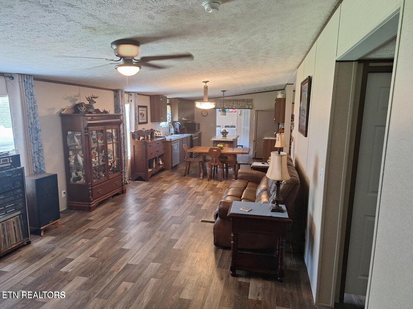 1450 Belltown Road Tellico Plains, TN 37385 - Photo 16 of 32 a view of living room with furniture and wooden floor