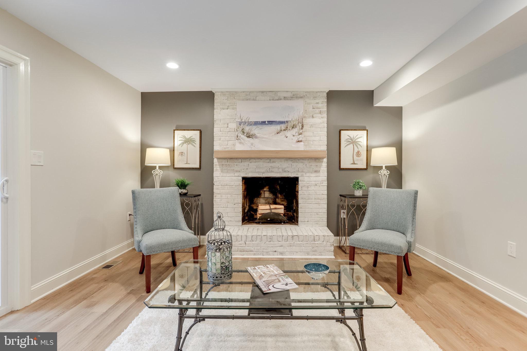 11208 Hunting Horn Lane Reston, VA 20191 - Photo 18 of 69 Wood burning fireplace with new mantel