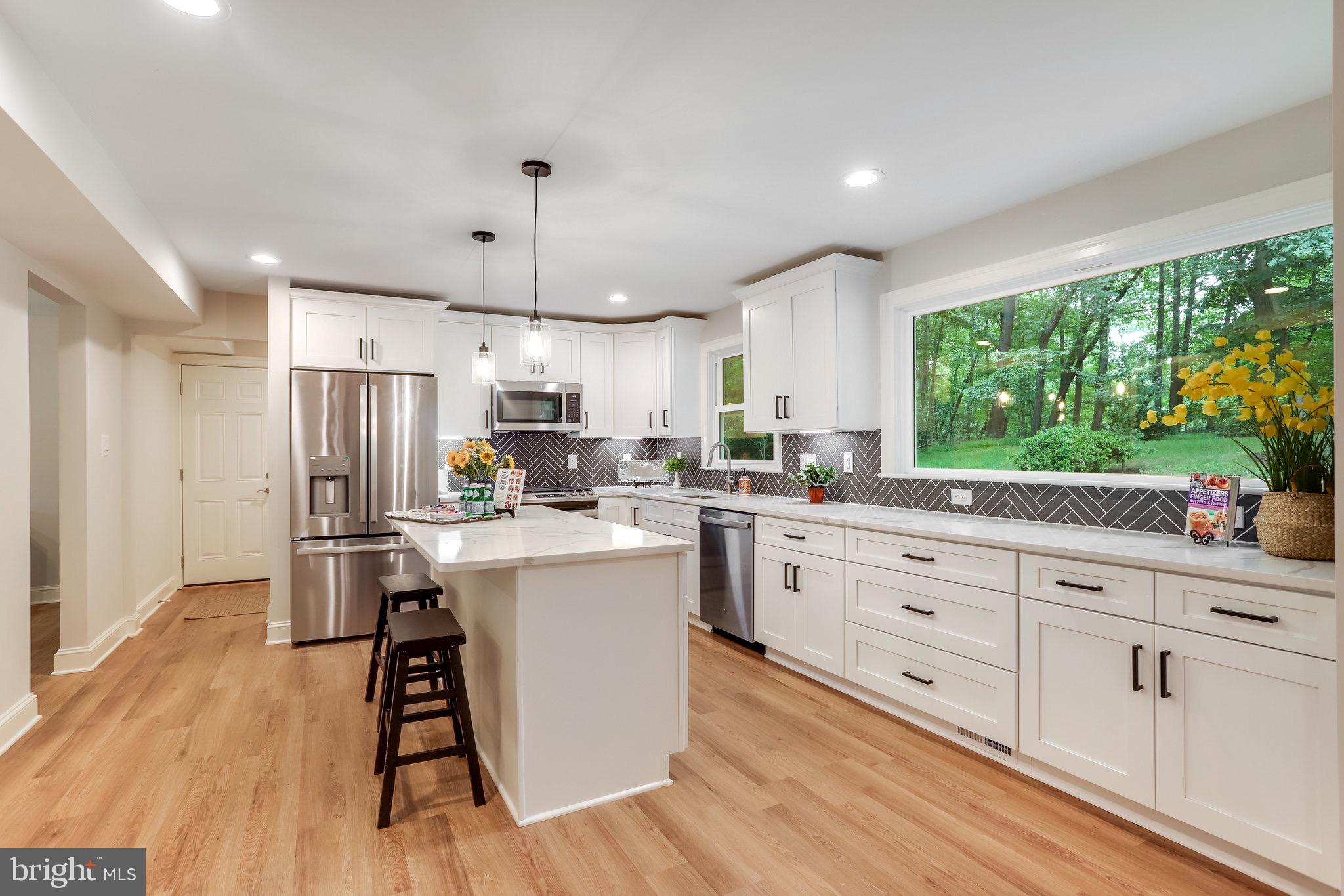 11208 Hunting Horn Lane Reston, VA 20191 - Photo 25 of 69 Light-filled & view of backyard