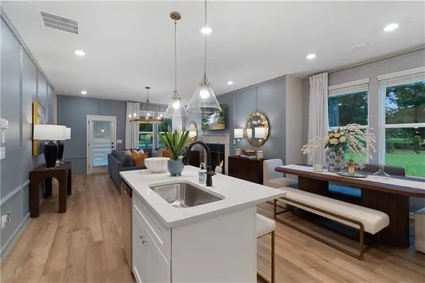 a kitchen with a table chairs and a kitchen view