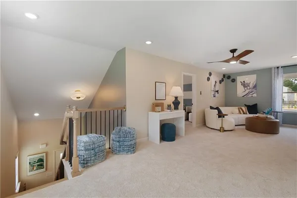 a living room with furniture and kitchen view