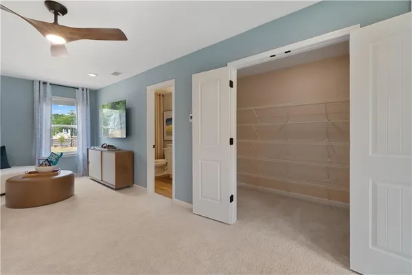 a view of a livingroom with furniture and windows