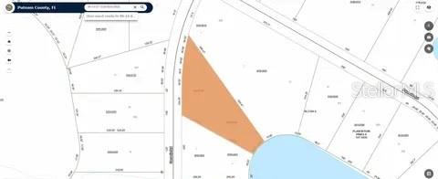 116 Osceola Road Georgetown, FL 32139 - Photo 16 of 16 a view of a living room with a white house and wooden floor