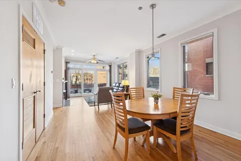 a dining room with furniture window wooden floor
