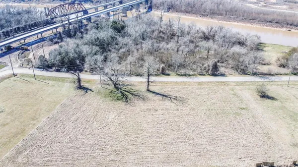 a view of a yard with large trees