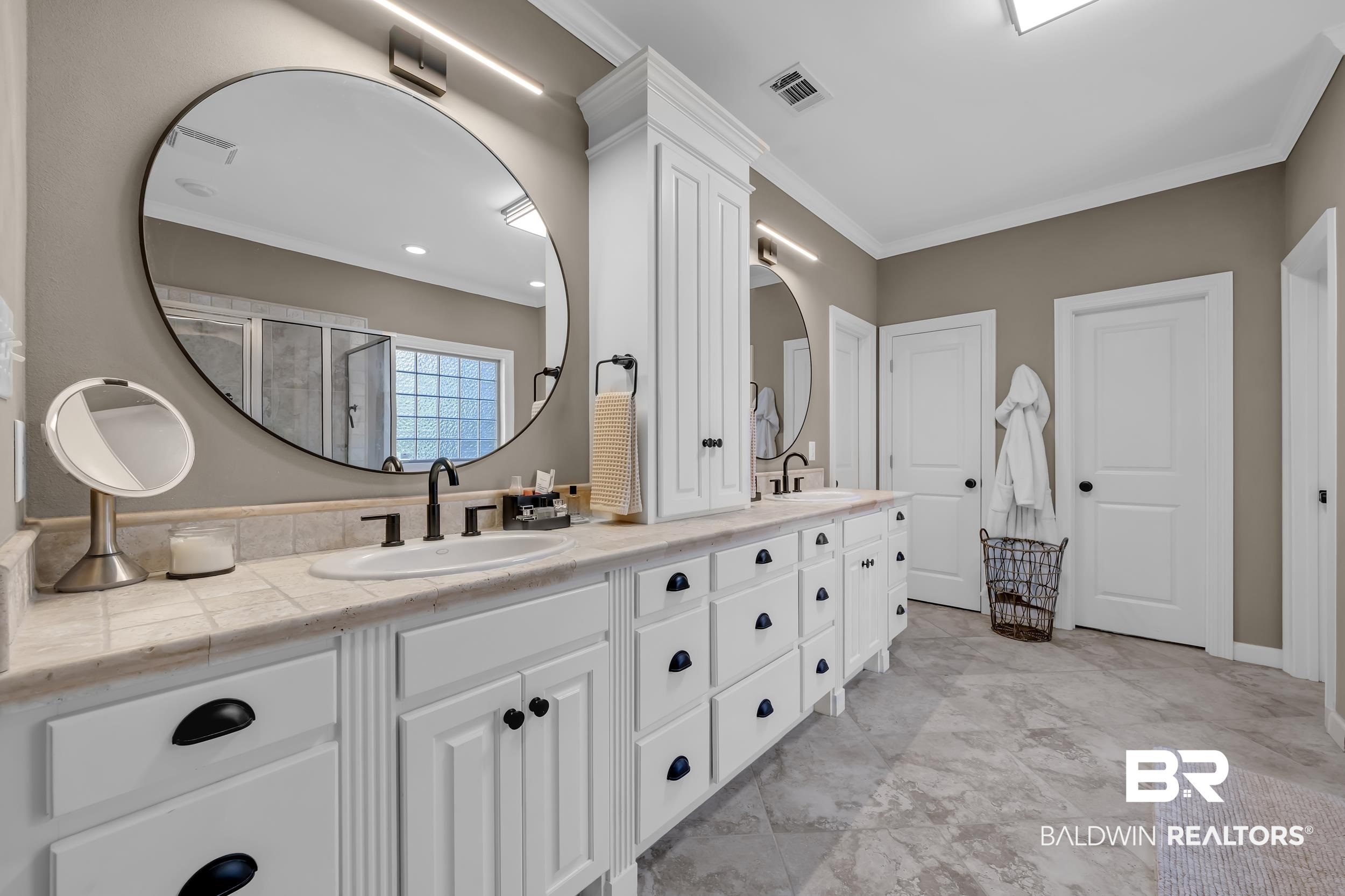 8137 Pine Run Daphne, AL 36527 - Photo 27 of 67 Dual vanity featuring white cabinetry, stone countertops with a tiled backsplash, and under-mount sinks