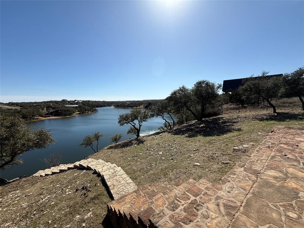 7037 Hells Gate Loop Strawn, TX 76475 - Photo 5 of 10 a view of a lake with a mountain