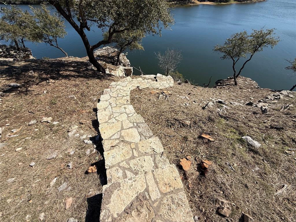7037 Hells Gate Loop Strawn, TX 76475 - Photo 7 of 10 a view of a backyard of a house