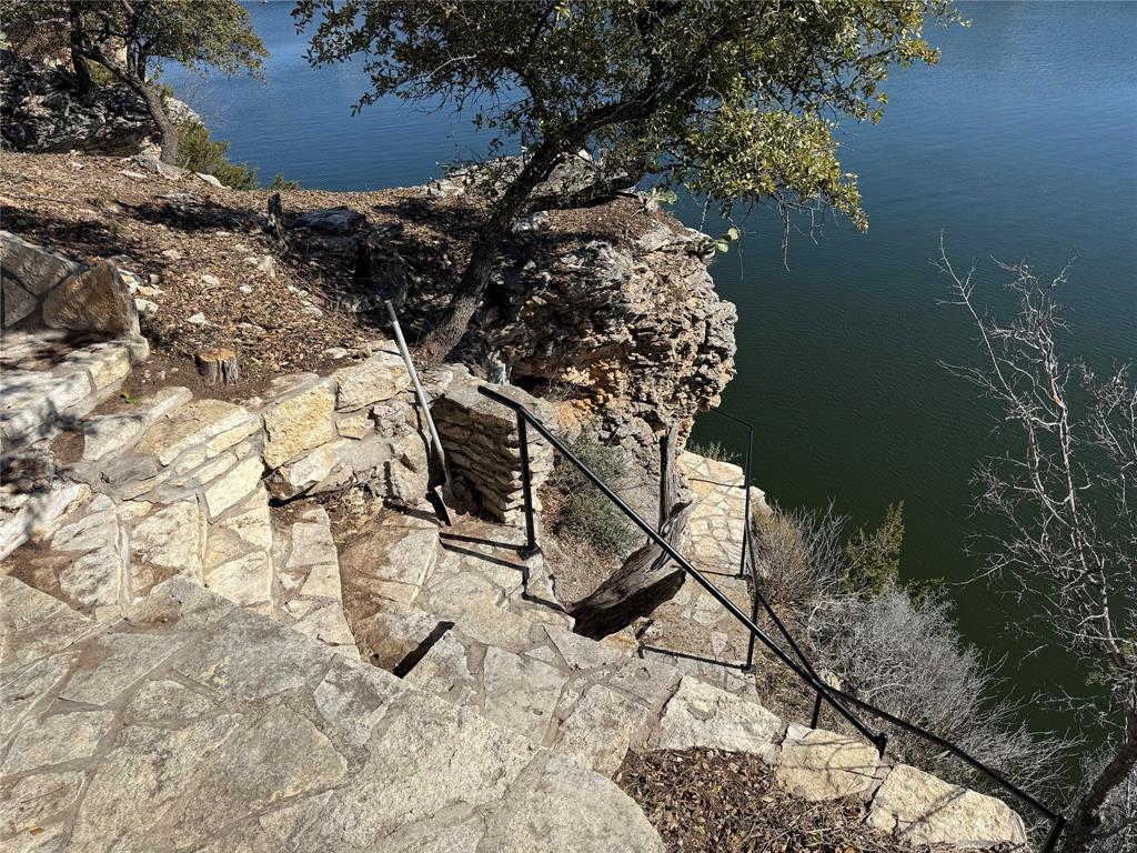 7037 Hells Gate Loop Strawn, TX 76475 - Photo 9 of 10 a backyard of a house