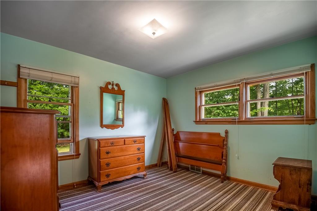 856 Sugar Hollow Road Hermitage, PA 16148 - Photo 14 of 18 a room with furniture and a window