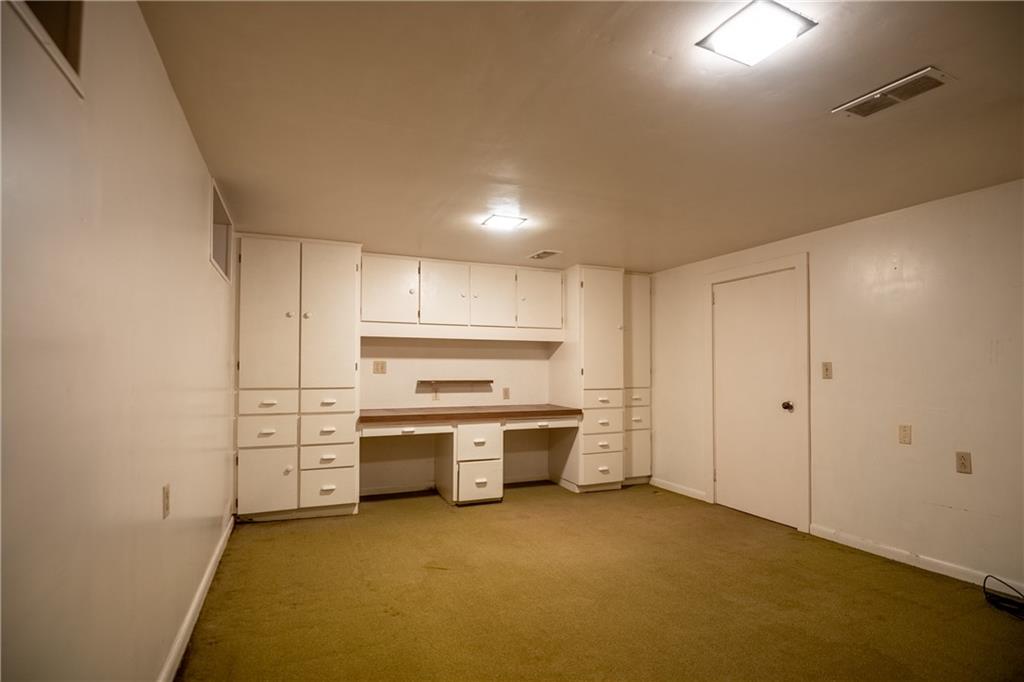856 Sugar Hollow Road Hermitage, PA 16148 - Photo 18 of 18 a kitchen with stainless steel appliances a stove and white cabinets