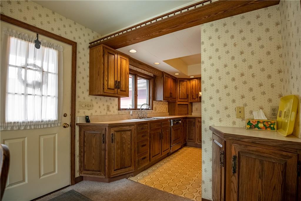 856 Sugar Hollow Road Hermitage, PA 16148 - Photo 7 of 18 a bathroom with a granite countertop sink a large mirror and a bathtub