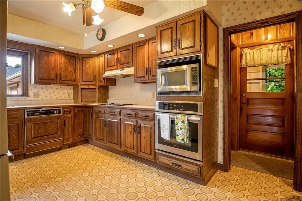 856 Sugar Hollow Road Hermitage, PA 16148 - Photo 9 of 18 a kitchen with stainless steel appliances granite countertop a stove and a refrigerator