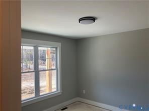 15335 Lebanon Road Spring Grove, VA 23881 - Photo 14 of 28 an empty room with a window