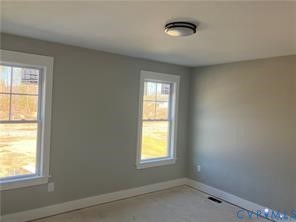 15335 Lebanon Road Spring Grove, VA 23881 - Photo 16 of 28 an empty room with a window