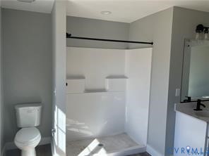 15335 Lebanon Road Spring Grove, VA 23881 - Photo 23 of 28 a bathroom with a toilet and a shower