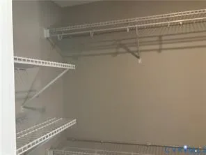 a view of a room with racks on the wall