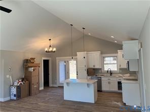 15335 Lebanon Road Spring Grove, VA 23881 - Photo 4 of 28 a kitchen with a refrigerator and a stove top oven