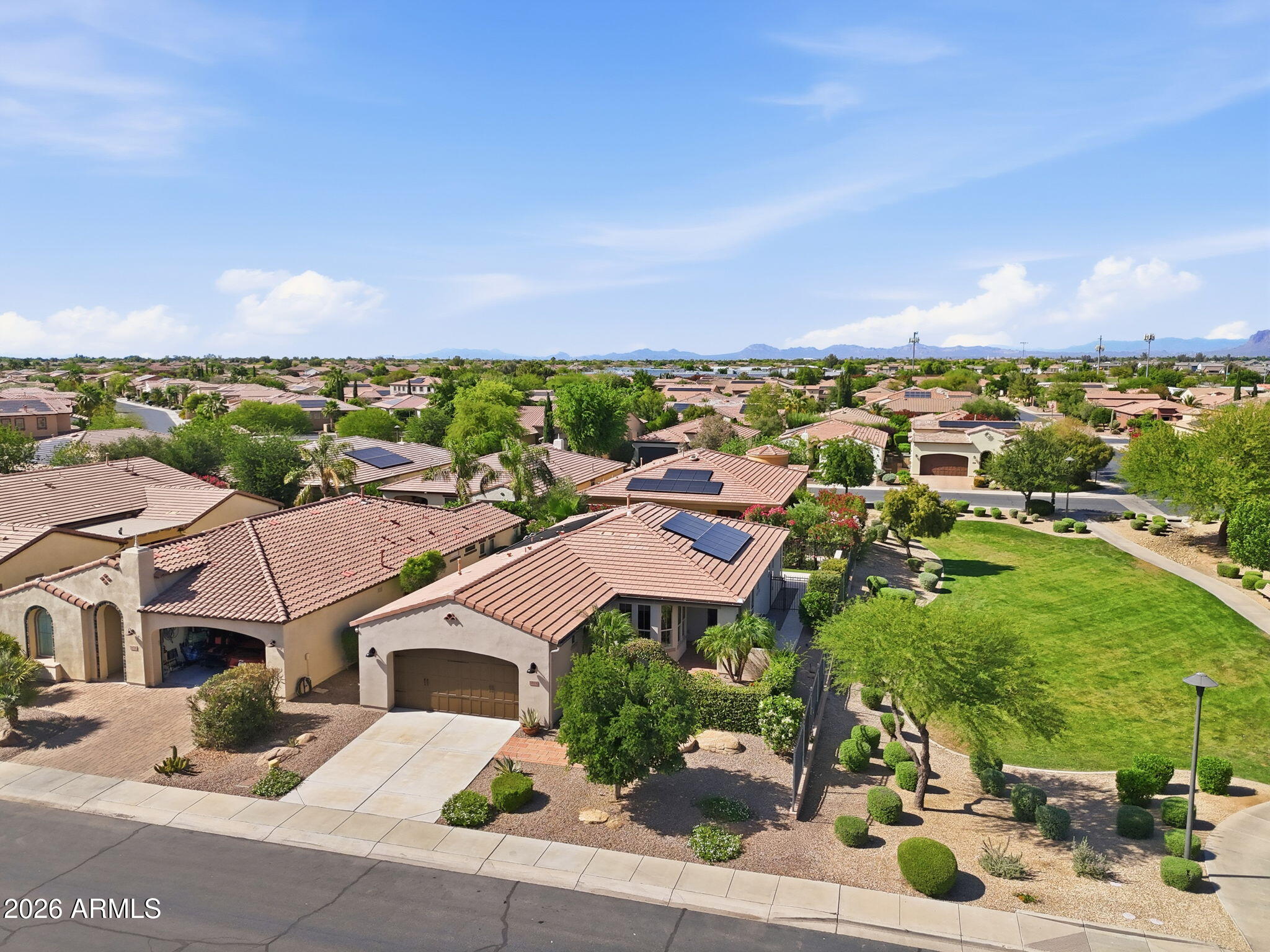 1694 East Grand Ridge Road Queen Creek, AZ 85140 - Photo 3 of 61 an aerial view of residential houses with outdoor space and street view