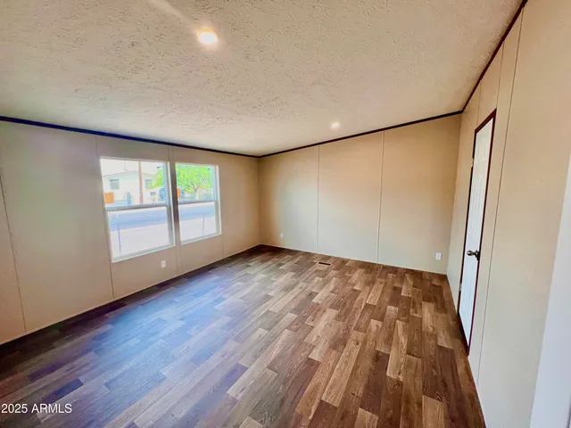 a kitchen with wooden cabinets and a stove top oven