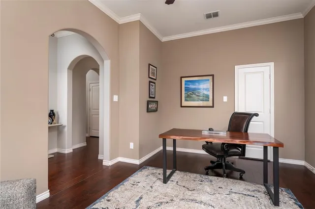 a workspace with furniture and wooden floor