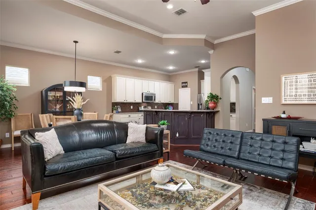 a living room with furniture and a rug