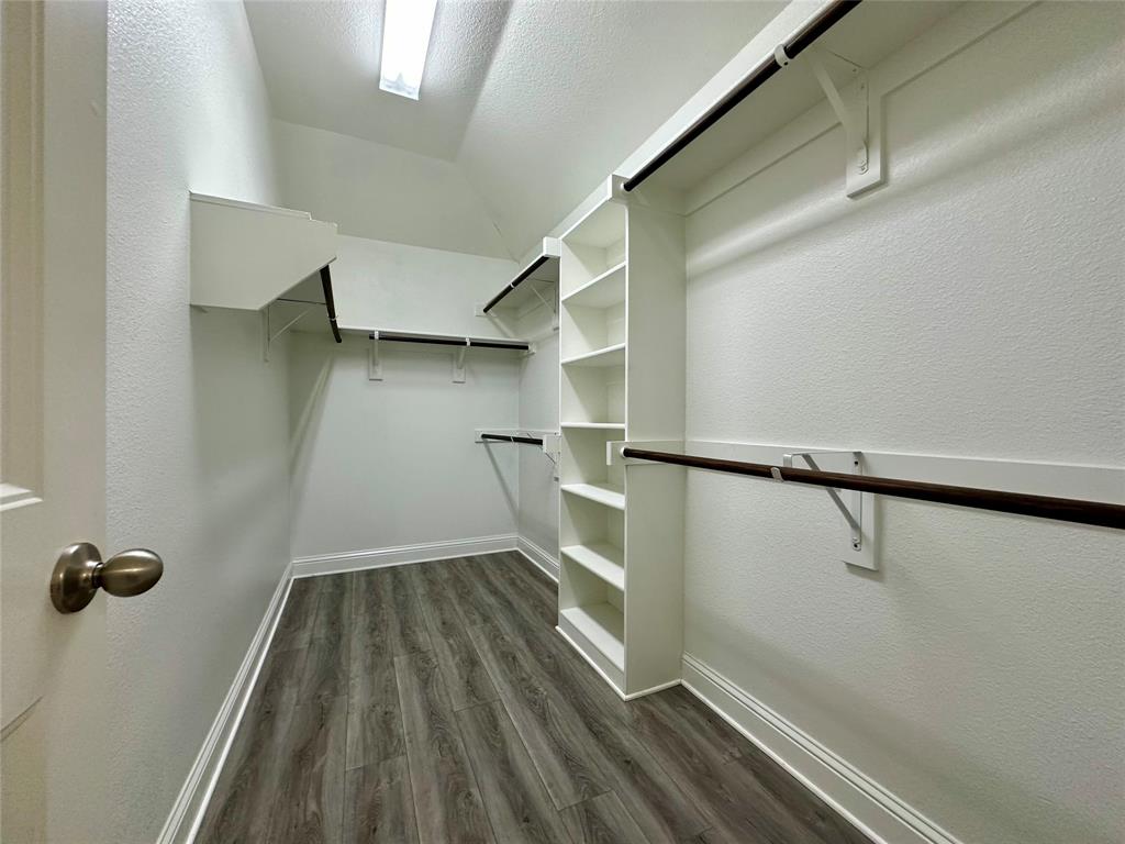 1223 Mount Olive Lane Forney, TX 75126 - Photo 25 of 28 Walk in closet with dark wood-style floors
