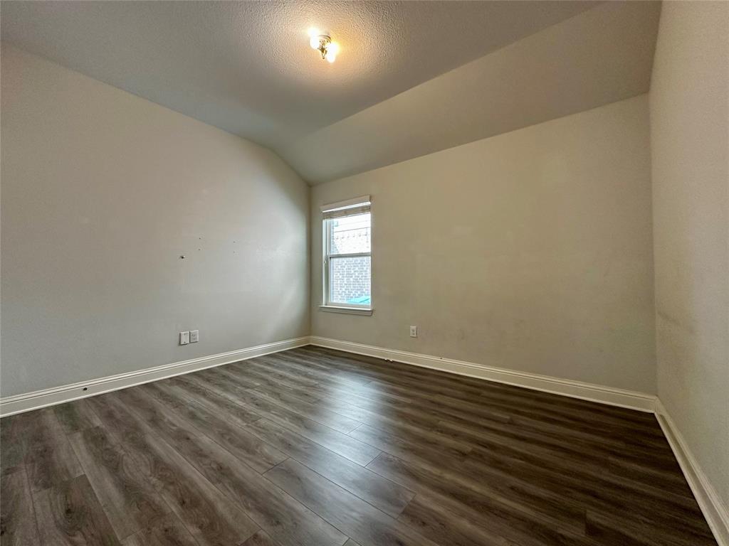 1223 Mount Olive Lane Forney, TX 75126 - Photo 5 of 28 Unfurnished room featuring dark wood-style flooring