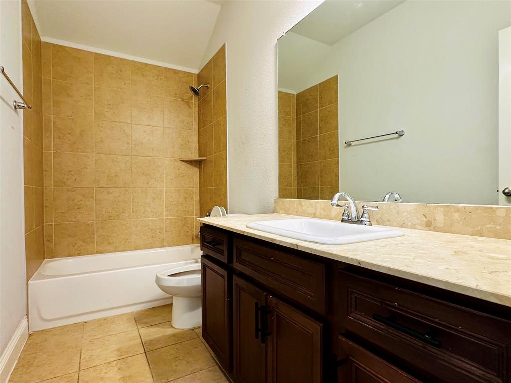 1223 Mount Olive Lane Forney, TX 75126 - Photo 7 of 28 Full bath with vanity, bathtub / shower combination, and light tile patterned flooring