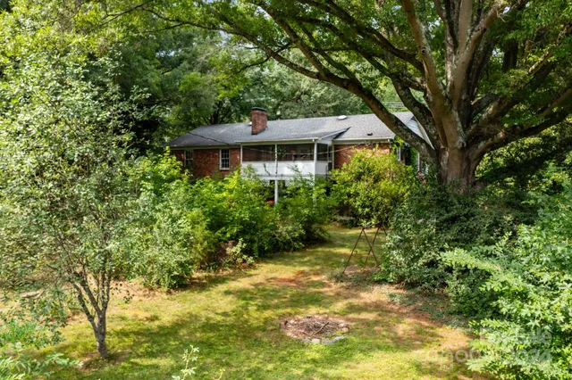 a view of a big yard in front of a house