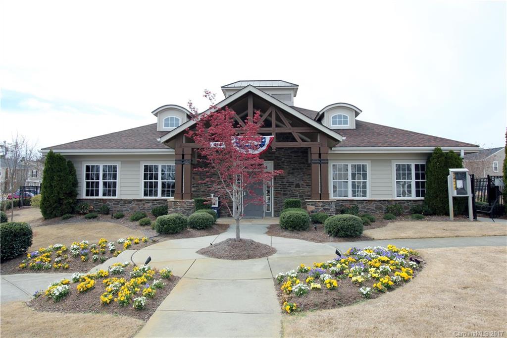 323 River Clay Road, Unit 127 Fort Mill, SC 29708 - Photo 14 of 16 a front view of a house with a garden