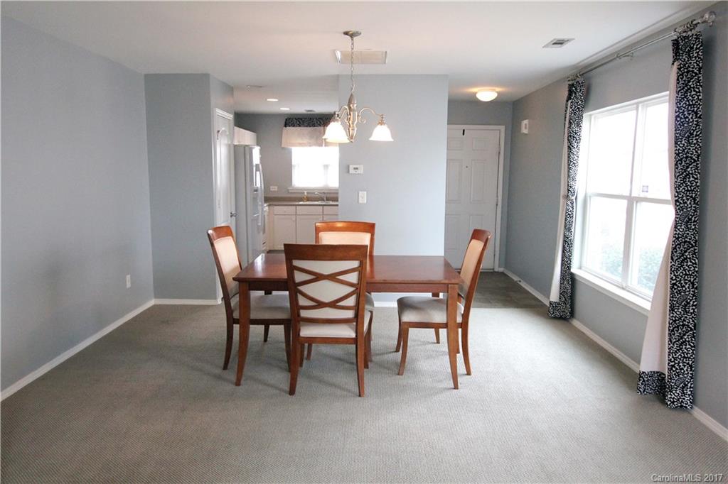 323 River Clay Road, Unit 127 Fort Mill, SC 29708 - Photo 3 of 16 a dining room with furniture and window