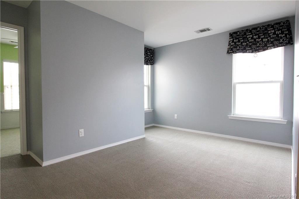 323 River Clay Road, Unit 127 Fort Mill, SC 29708 - Photo 8 of 16 an empty room with windows and closet
