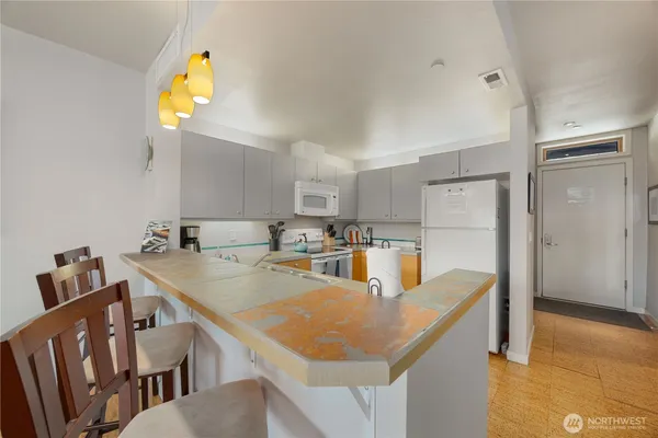 a view of kitchen dining table and chairs