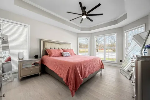 a en suite bathroom with a sink double vanity and a mirror