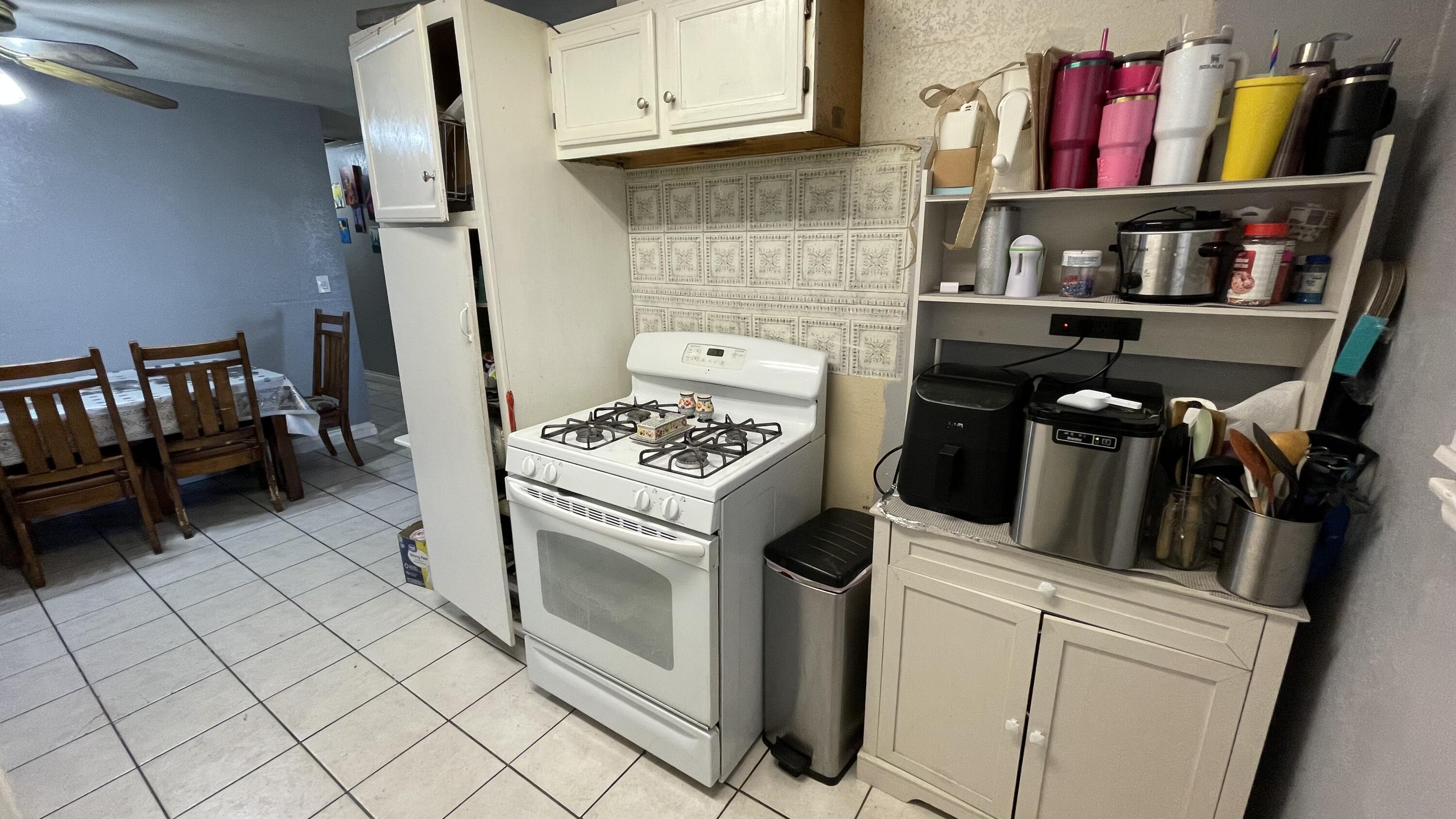 83644 Ave 44 Indio, CA 92203 - Photo 8 of 24 a kitchen with appliances cabinets and a counter top space