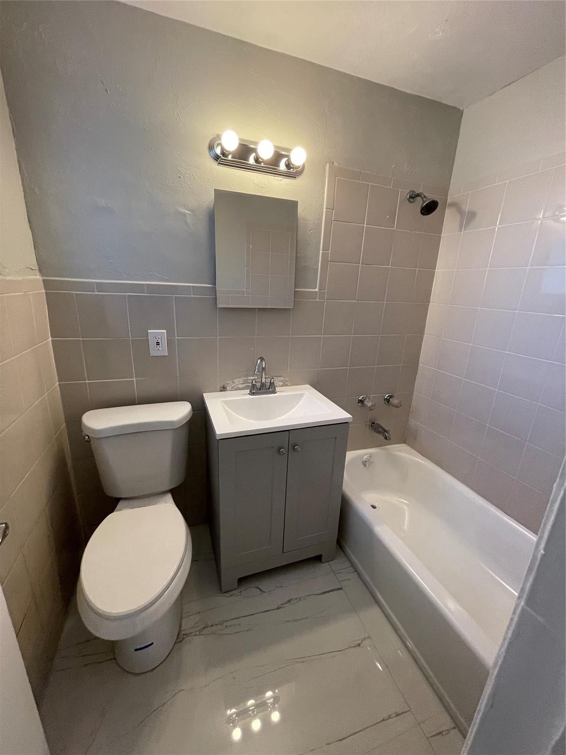 721 Southwest 8th Street Pompano Beach, FL 33060 - Photo 19 of 21 a bathroom with a toilet sink and mirror