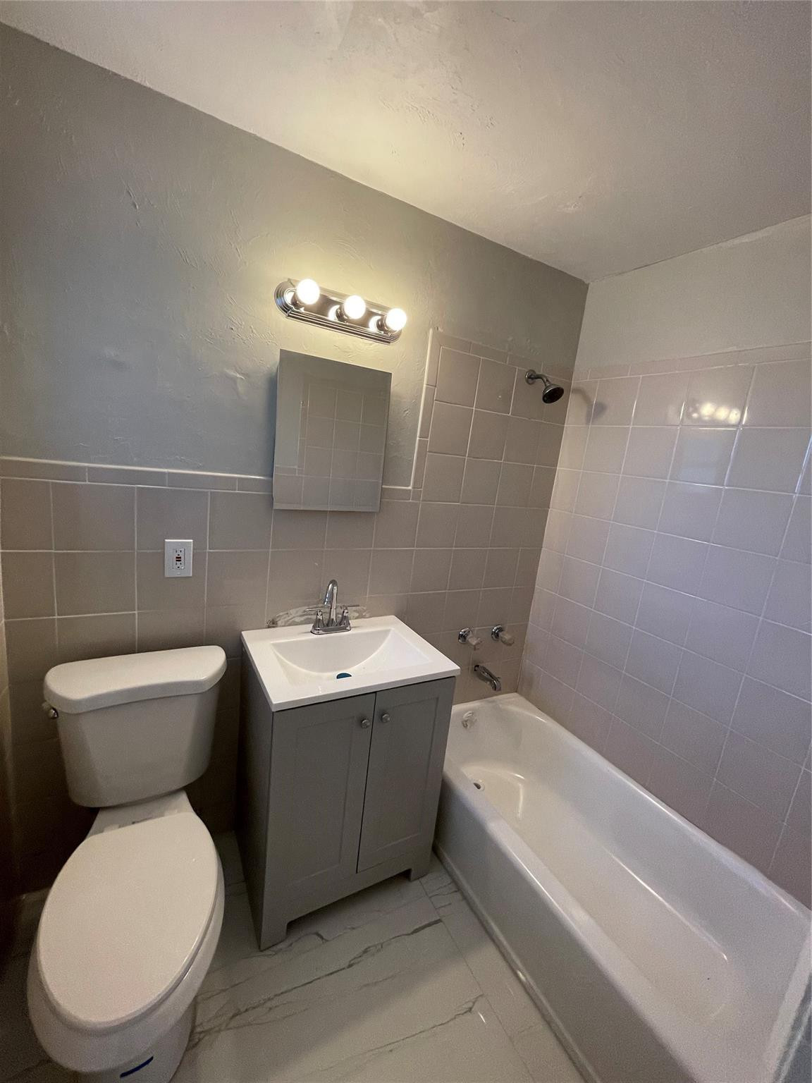 721 Southwest 8th Street Pompano Beach, FL 33060 - Photo 20 of 21 a bathroom with a toilet sink and mirror or bathtub