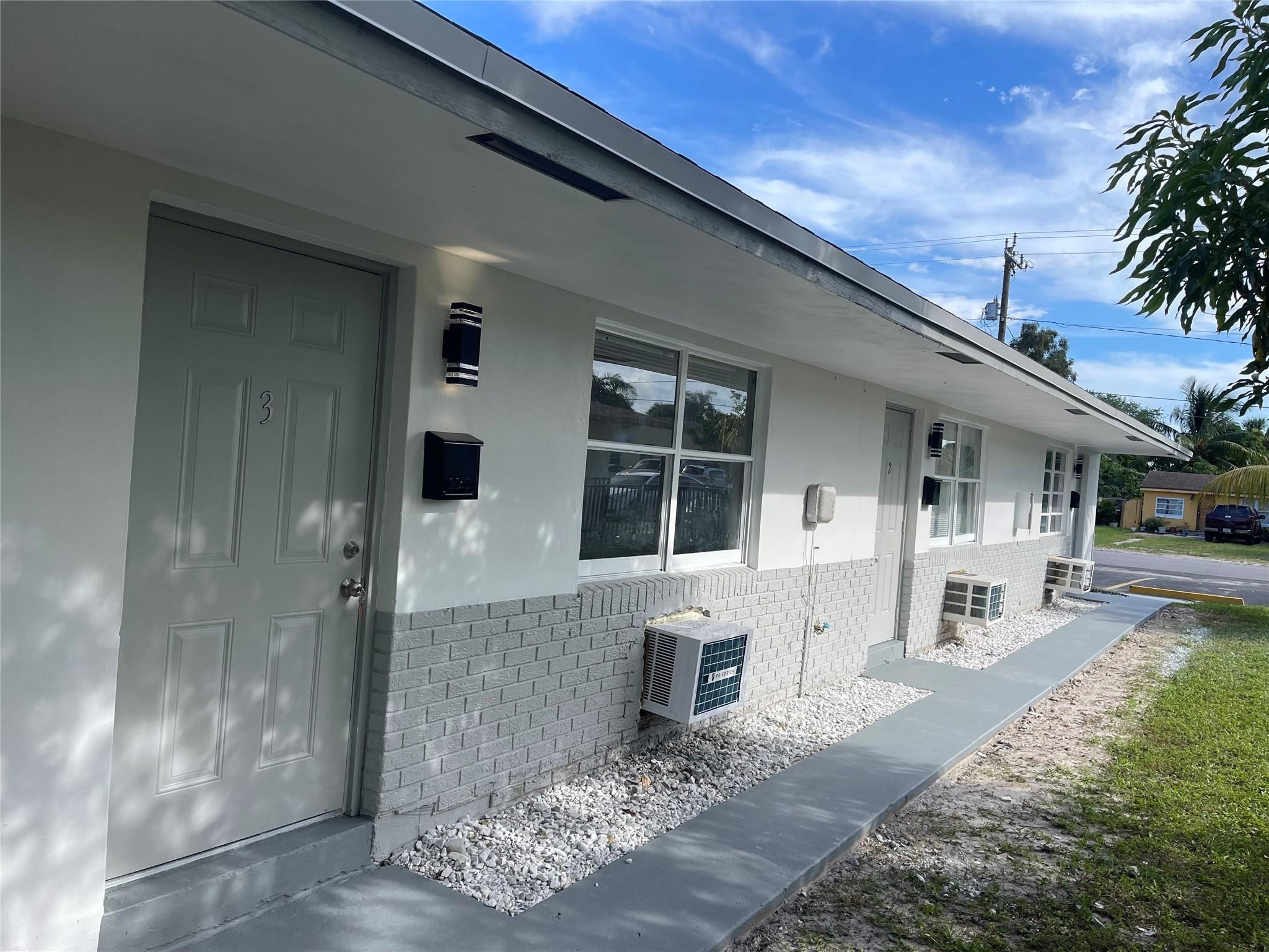 721 Southwest 8th Street Pompano Beach, FL 33060 - Photo 3 of 21 a front view of a house with fountain